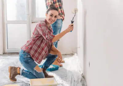 10-stock-photo-happy-young-woman-painting-wall-smiling-camera-new-apartment