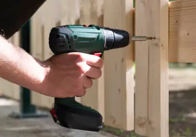 17-stock-photo-male-hand-holding-drill-drive-while-screwing-screw
