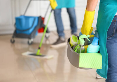 3-stock-photo-female-janitor-with-cleaning-supplies-in-kitchen