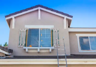 8-stock-photo-ladder-leaning-up-against-a-house-ready-for-new-paint